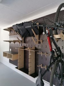 Garage Storage Solution Wall Panels With Shelving, Hooks And A Workbench Mounted