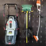 Garage Storage Solution Wall Panels And Hooks With Gardening Equipment Mounted